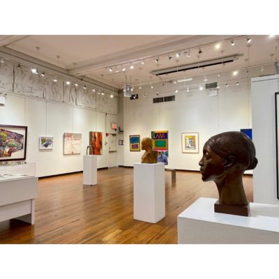 Wide angle view of the Exhibition at the Art Students League. Visible works include sculptures by Elizabeth Catlett and Otto Neals. Other paintings and works on paper by Sam Gilliam, Charles Alston, Nanette Carter, Mavis Pusey, Ray Grist, Frank Wimberly, and Ademola Olugebefola in the background.