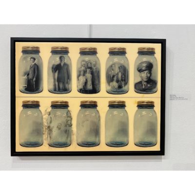 "Mattoon #4," a multimedia composition by Debra Priestly of family photographs in mason jars was loaned by the PFF Collection for the Cinque Gallery exhibition.
