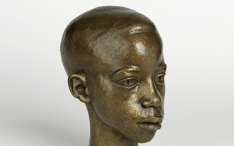 William Artis, Michael (Head of a Boy), 1950. Bronze bust of a young boy with a greenish-copper patina.