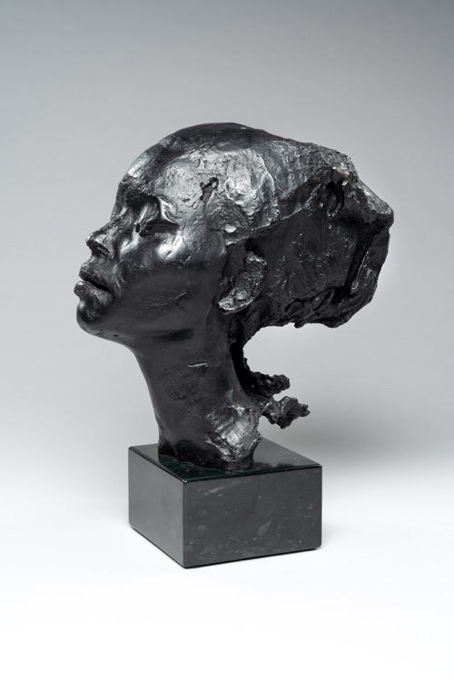 Artis Lane, Muse, Black Patina Bronze, 1990. Bust of young woman with hair pulled back.